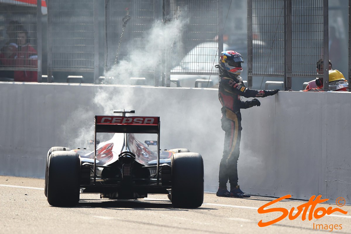 MSI_Images's tweet photo. Drama - @MaxVerstappen3 climbs out of his smoking @ToroRossoSpy on the pit straight #ChineseGP #F1 http://t.co/UdRwbQTNKa