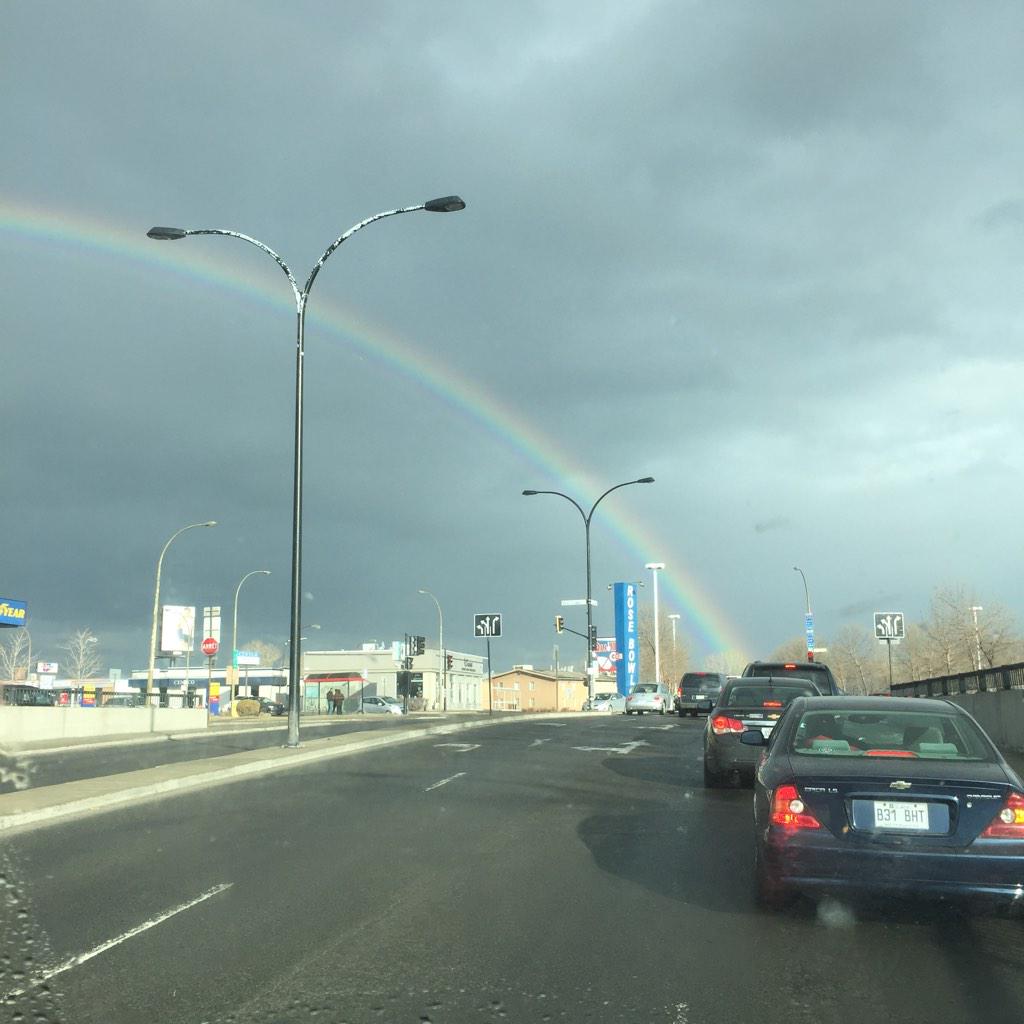RyanWilner's tweet photo. Searching for the pothole of gold at the end of the rainbow. #montreal #pothole #rainbow http://t.co/noznctvNdz
