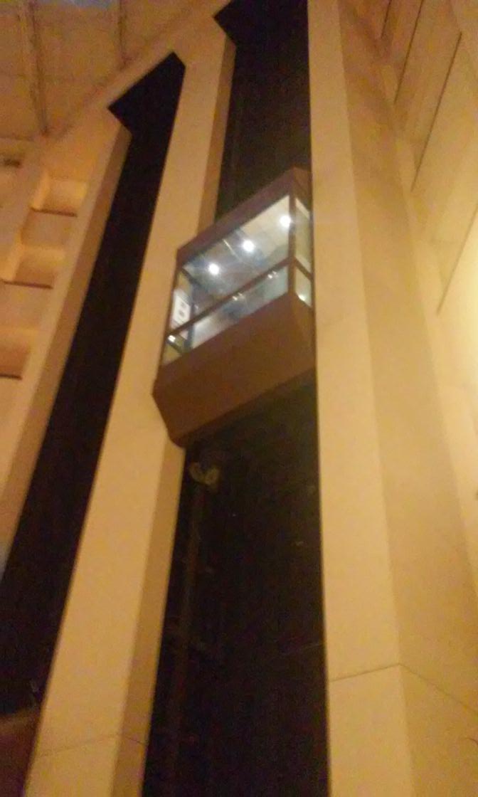 Morbid thought of the day:
If the impact of the elevator falling doesn't kill you, the glass shards will