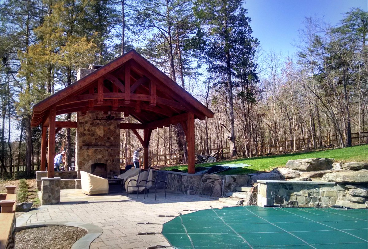 This open truss Cedar pavilion with fireplace we built in Chantilly two years ago still looks great!