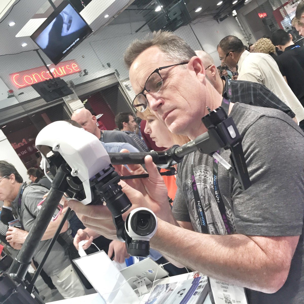 AMPcreate's tweet image. Sandy checking out the DJI booth at NAB. Inspire 1 or new Phantom 3? #NABShow2015 #amediapro #HandsOnTechnology