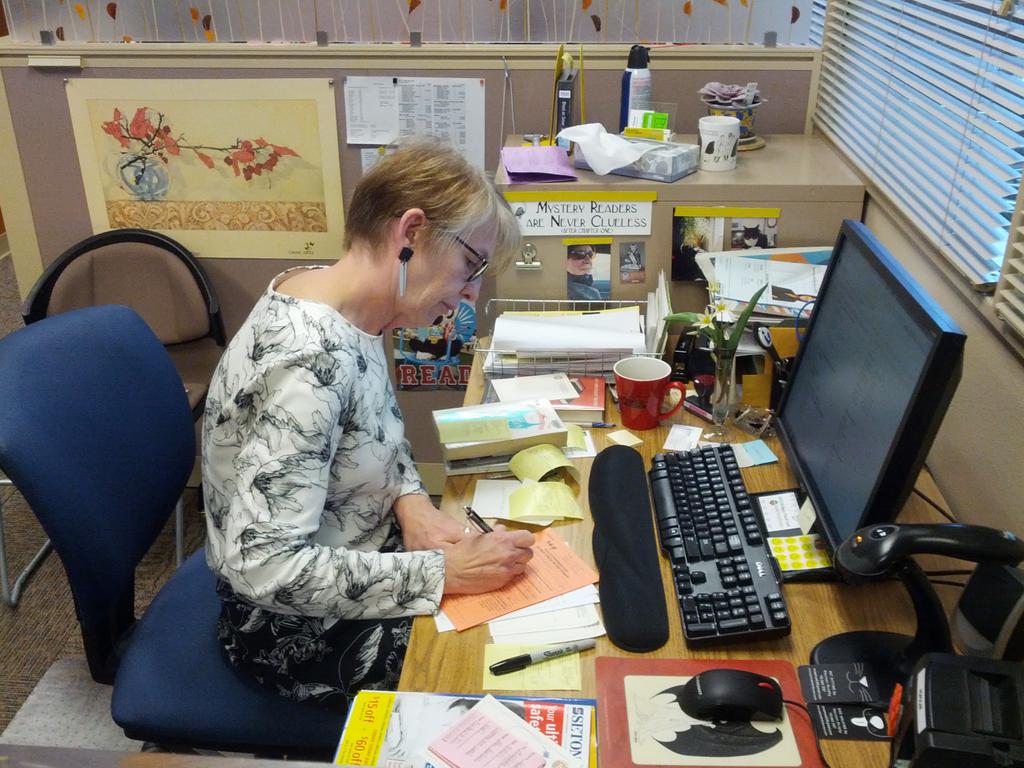 midlibraryorg's tweet image. Barbara is sorting out paperwork for damaged/parts-missing items. #librariesworkbecausewedo  #nlwd15 #NLW15