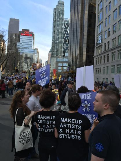 IATSE's tweet image. Members rally in NYC to #FightFor15!