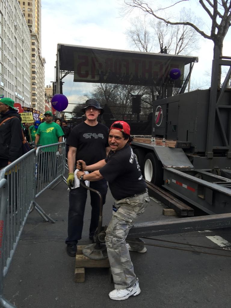 IATSE's tweet image. .@LocalOneIATSE members helped build staging for the #FightFor15 rally in NYC! Union labor gets the job done right.