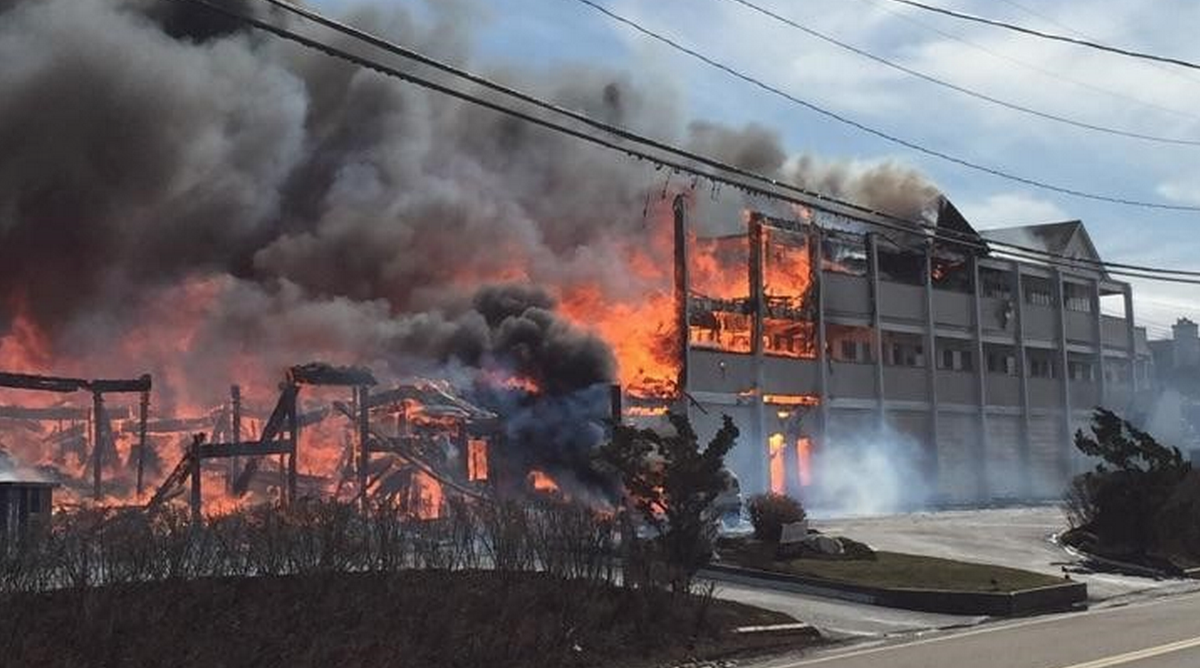 Newsday's tweet photo. A fire that engulfed a waterfront Hamptons co-op likely destroyed the property, official says http://t.co/RkHDLYB2pb http://t.co/HUh2Hq8kQ6
