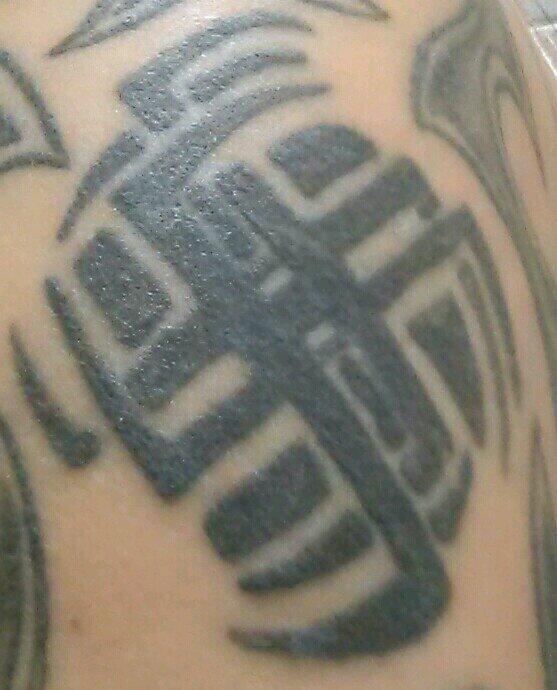 Krisie73's tweet photo. @X929 re-submission from last year.. still need help #foolishyouth #lookslikefancyswastika  #x929WorstTattoo http://t.co/XC6UDRnbJj