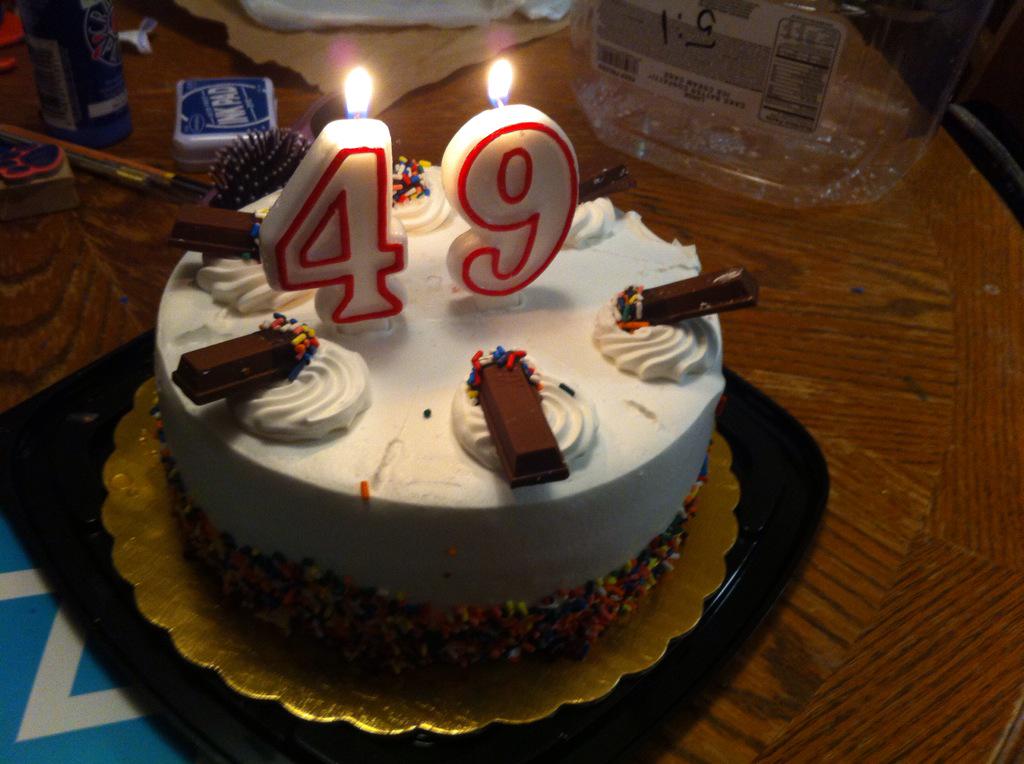 Premium Photo | 3d rendering of a big blue birthday cake with a big number  forty on top