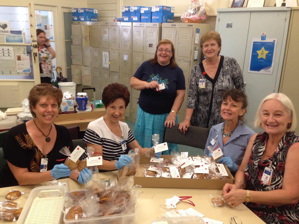 PTSDInitiative's tweet photo. @thedjcronin @GMRF Look at the amazing #GPH volunteers hard at work packaging homemade Anzac biscuits for the Ball :) http://t.co/8l98mZwtOe