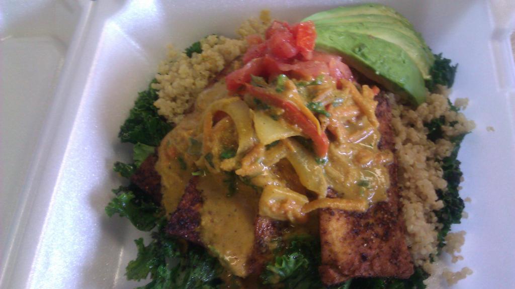 Coconut Curried Blackened Tofu,cilantro shaved golden beet tossed steamed quinoa on a bed of charred limed kale VEGAN