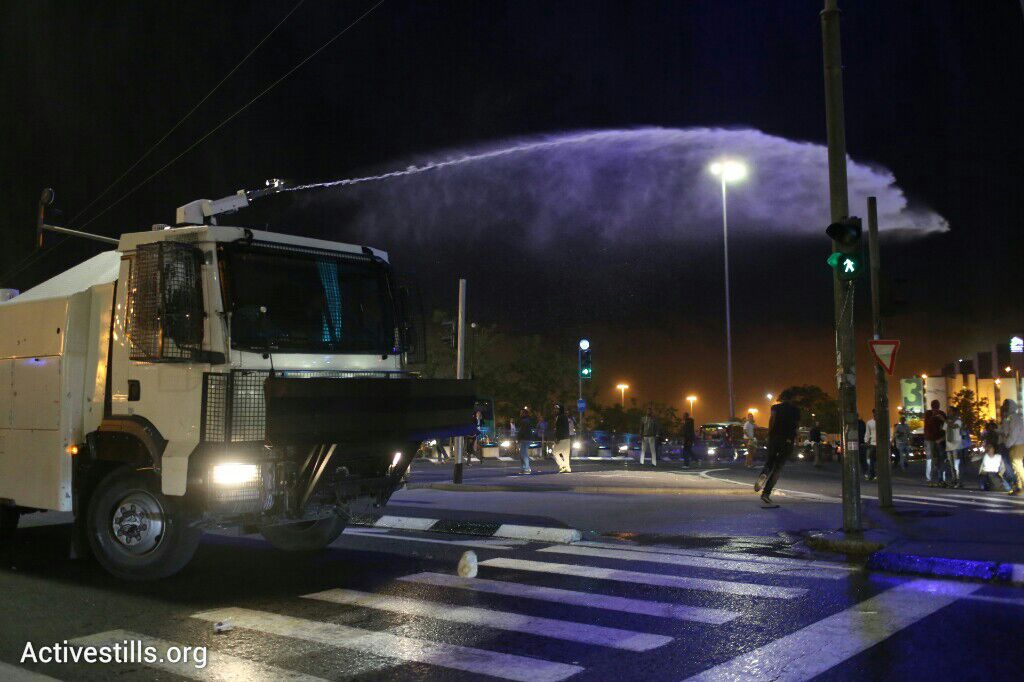 syndicalisms's tweet photo. "Skunk" water sprayed against Ethiopian Jews protesting police brutality in #Jerusalem. http://t.co/ZyUXDP3niu
