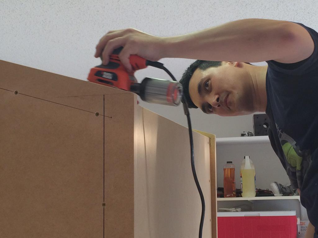 BRCade2015's tweet photo. Final sanding taking place on the cabinet #BRCade #RocketScience15 @_BottleRocket http://t.co/l73Nz9vnI5