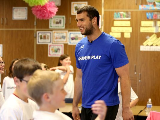 indystar's tweet photo. Andrew Luck runs a quarterback sneak on some third-graders. Watch their surprised reaction. http://t.co/TrPUF7Q7aN http://t.co/gBPX18BqPM