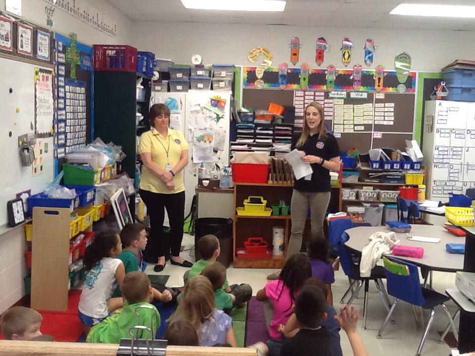 Wescom volunteers visit NBG to teach first grade how to use 9-1-1!
