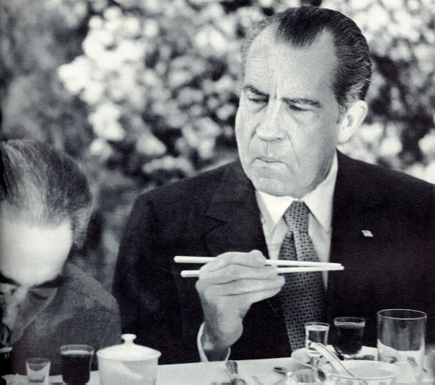 DaysBack's tweet image. President Richard Nixon trying to figure out how to use chopsticks while visiting in China. 1972.
