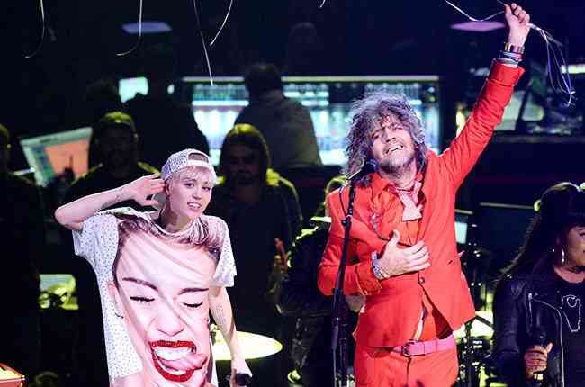 billboard's tweet photo. .@WayneCoyne on his "wiser, sadder" new project with @MileyCyrus: http://t.co/nbCK5ajKB1 http://t.co/vMcHnEJOso
