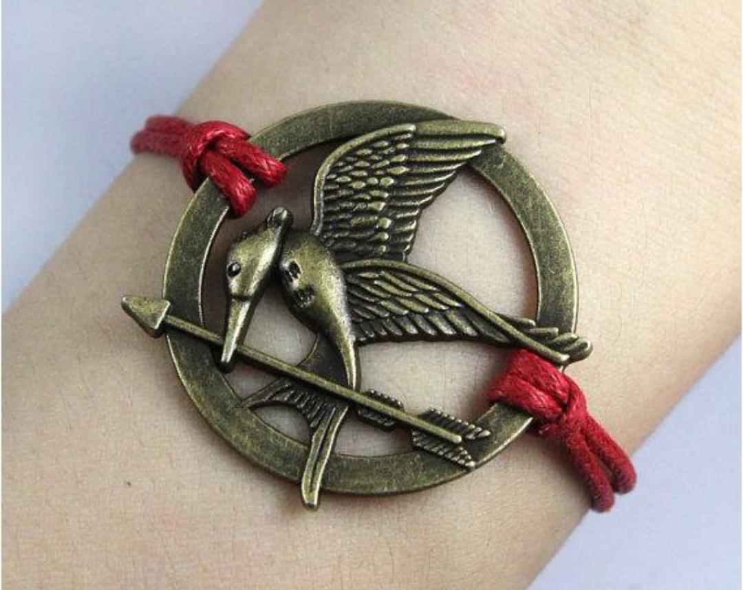 _fandomania's tweet image. Pulsera Sinsajo 3'50€