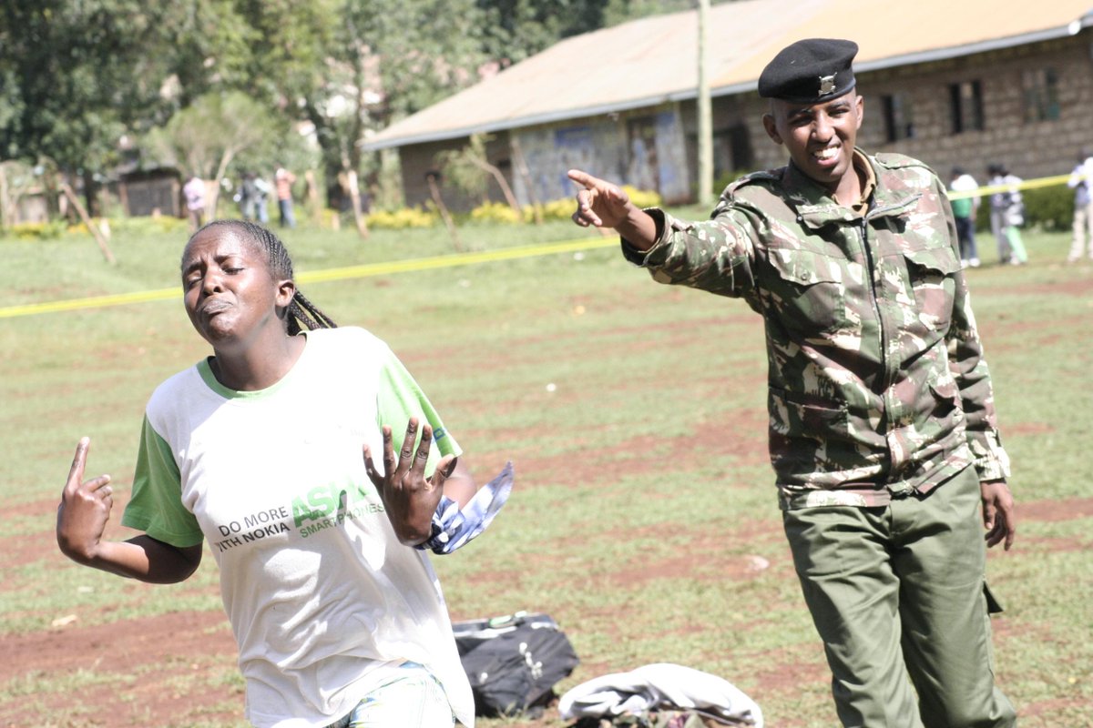 NationFmKE's tweet photo. A police recruit is directed to the queue after finishing the race at #Kinoru Primary School grounds in Meru http://t.co/ziF9YBFJmQ