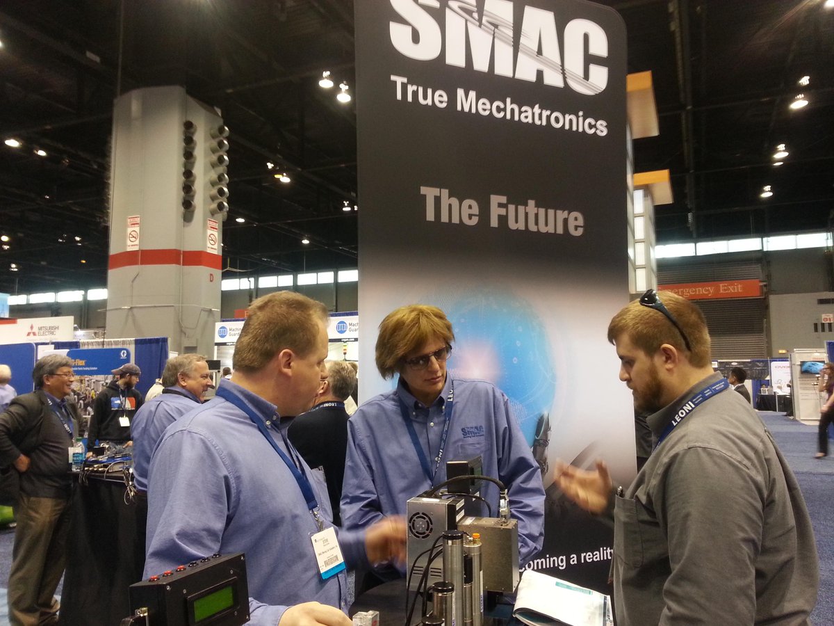 SMACMCAUS's tweet image. The Steves of SMAC Moving Coil Actuators talk applications with a visitor at #Automate2015