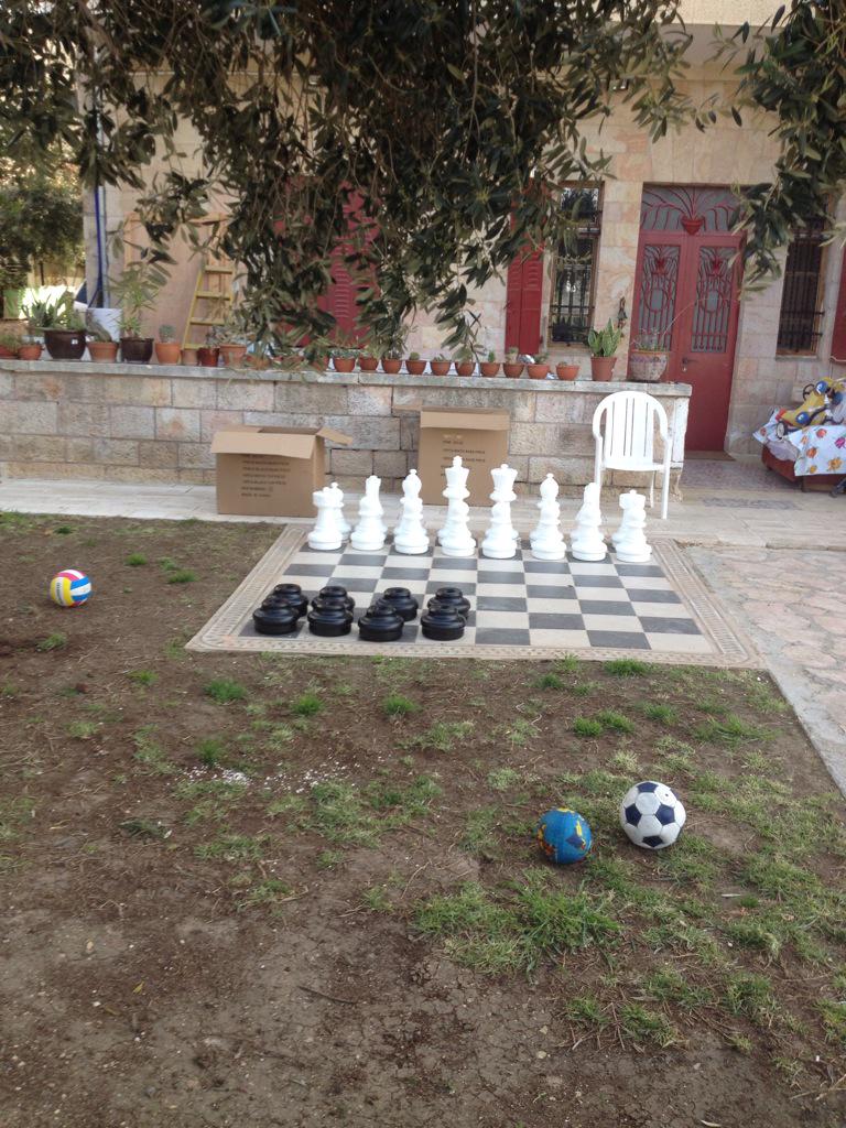 SmarterGarden's tweet photo. Giant chess pieces in Jerusalem yard http://t.co/i7N51bEbT9