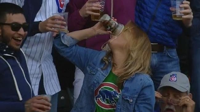 cmail_sport's tweet photo. Catch the ball in beer cup, drink the beer: Woman shows the boys how it's done. http://t.co/9qpb0Rw0EO @peterp79 http://t.co/k2i9Bs82pk