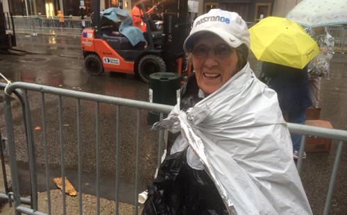 runnersworld's tweet photo. The oldest #BostonMarathon runner finished with a smile (despite the weather!): http://t.co/czYPapEE8r http://t.co/zPHqFLo76F