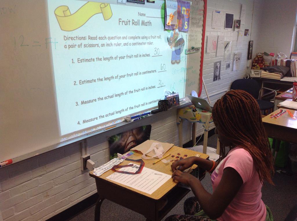 5th grade math using Fruit Roll-ups to measure length in customary and metric units.   <a href="/APSMath/">APS Math Office</a>