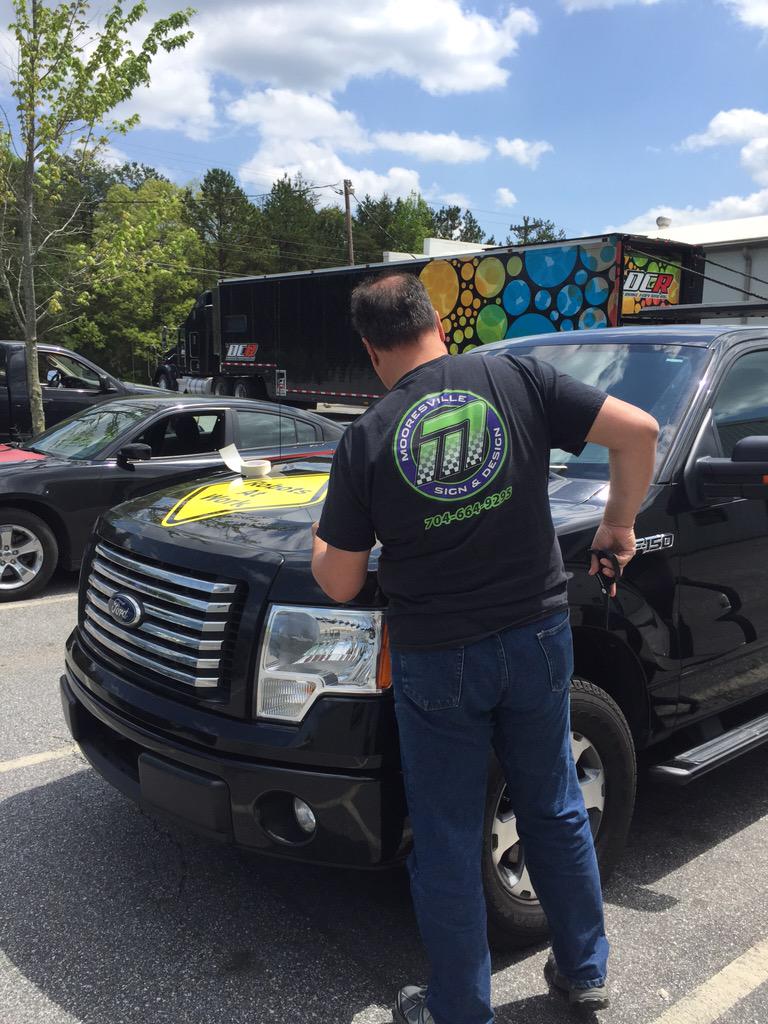 Luis is working on an install on this beautiful day! Promotion on your vehicle is great advertisement!