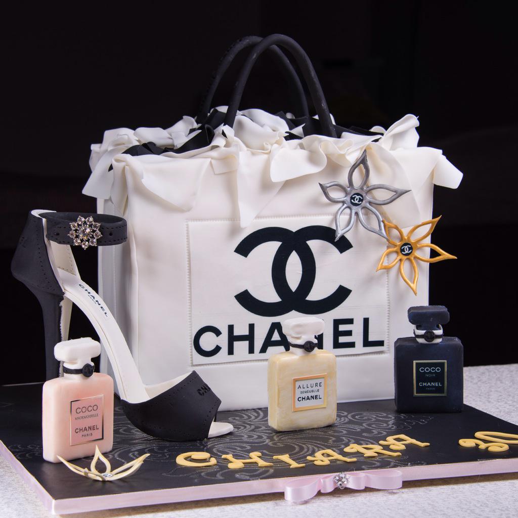 Moreish's tweet photo. High fashion cake for a high fashion lady! All edible bar the bling! #moreish #moreishcakes #chanel #chanelcake http://t.co/geUFSGmIaX