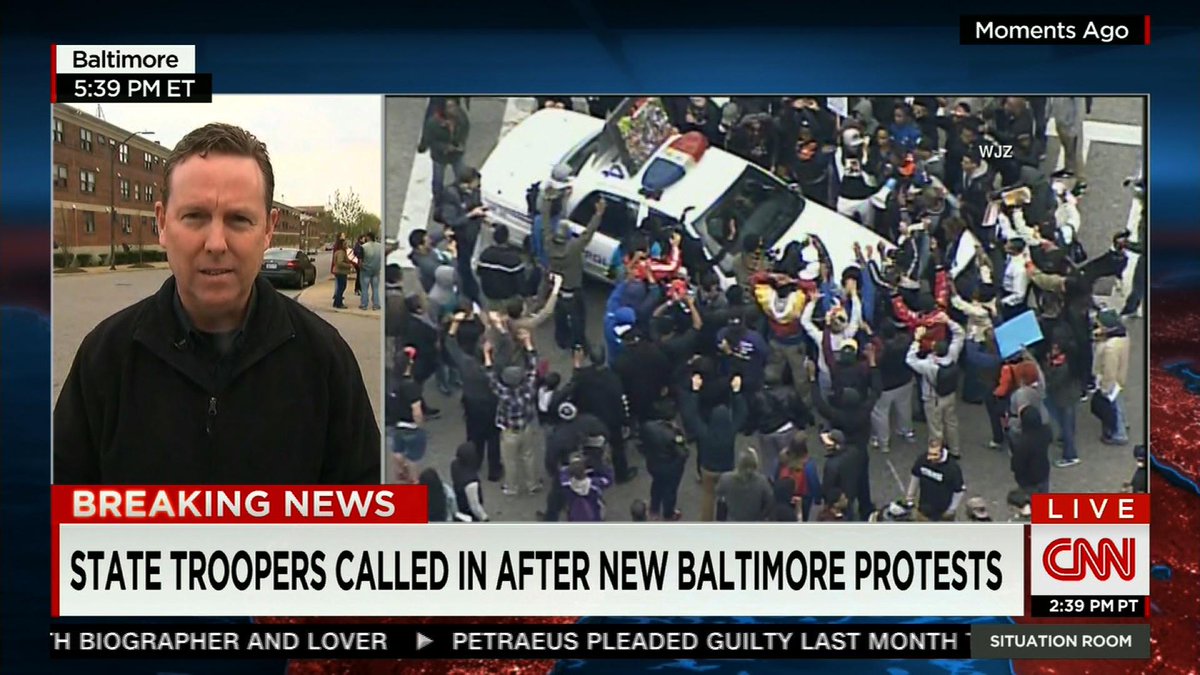 #FreddieGray protesters surround police cruiser in Baltimore