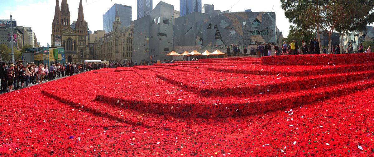 clarerawlinson's tweet photo. Just a few (180,000!) hand-knitted poppies, blanketing Fed Sq ahead of #AnzacDay http://t.co/79YbsB2eOL