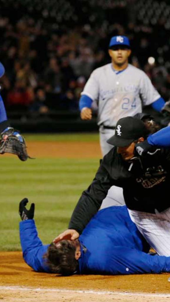 rosscridgers's tweet photo. This is 6-6 former college football player Jeff Samardzija on top of 57 year old Royals coach Mike Jirschele http://t.co/HFohTV85FP