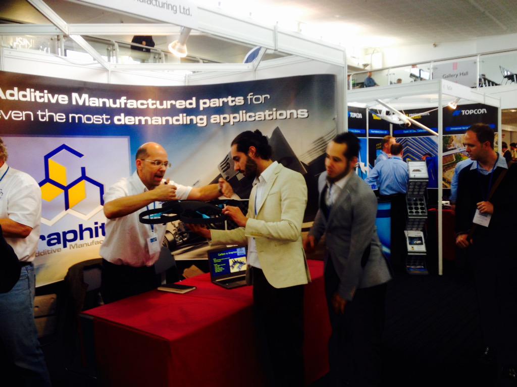 MapperAero's tweet photo. The guys talking 3d printing with @Graphite. Mind blowing! #SkyTech2015 #drones #welovedrones http://t.co/H0GeDmJz89