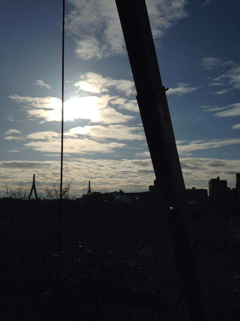 ErikRuedaDesign's tweet photo. Crane lifting desks to 6th floor. Zakim bridge in the background http://t.co/XtgOd0udfh