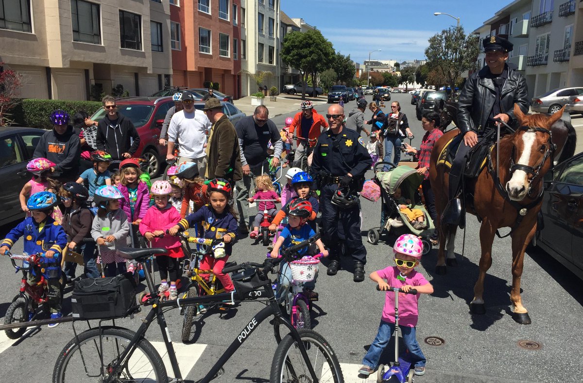 It's ride your bike or your horse to school day.  #SFPD Mounted Unit helps Laurel Hill Nursery kids get there safely