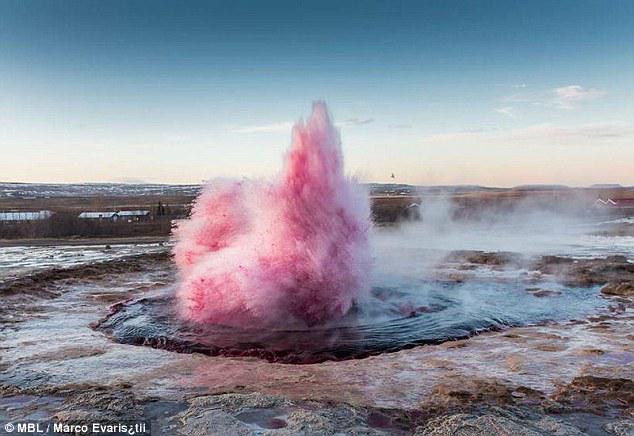 DailyMail's tweet photo. Chilean artist jailed for turning Iceland's hot spring pink with food colouring  http://t.co/tKFA3bRr07 http://t.co/lbGUqvaFpP
