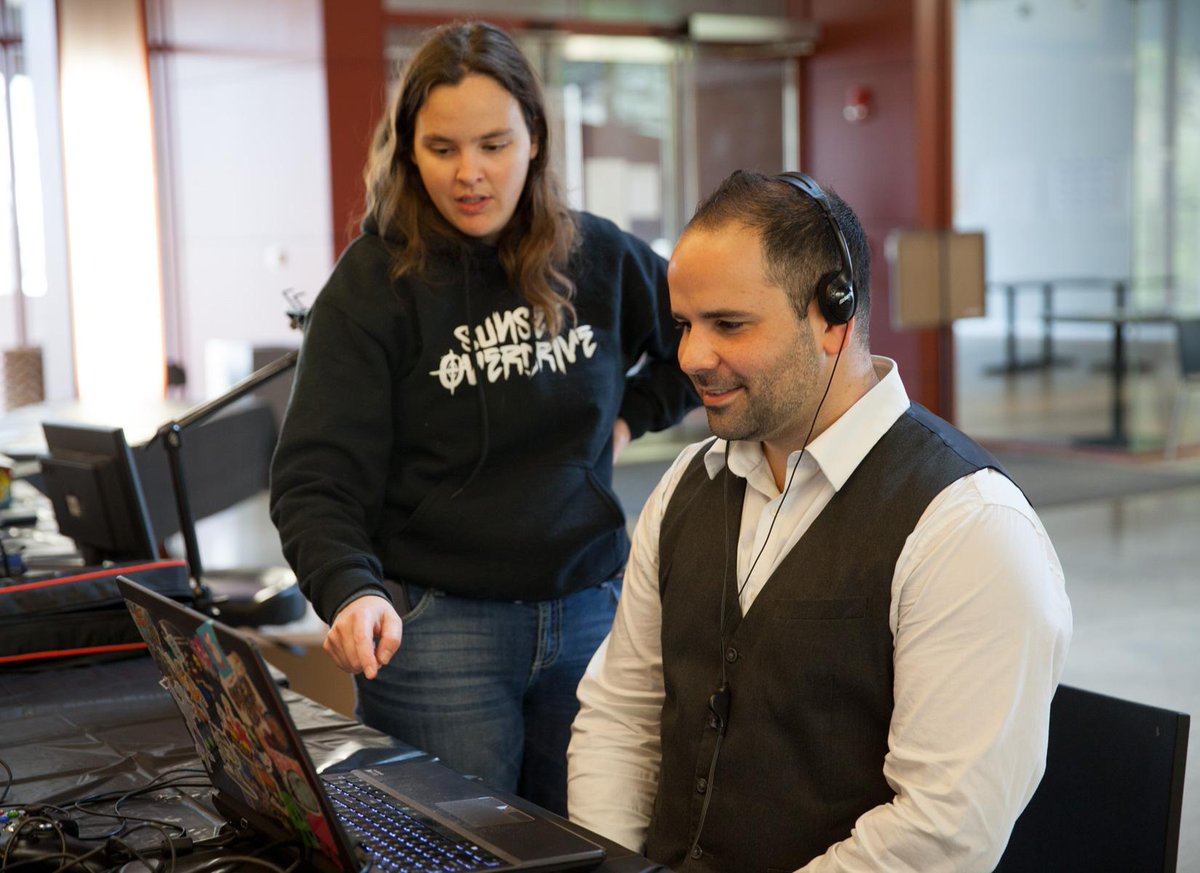 EPX_Studio's tweet photo. Lisa Brown (@wertle) showing Ty Johnson of LAIKA Entertainment her eye-tracking concentration game #EPXCON15 http://t.co/PDp9YDLrtU