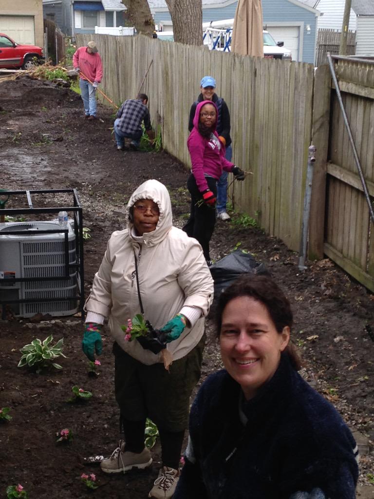 HeartChangeIndy's tweet photo. Planting in the rain on Tuxedo! #Serve15 http://t.co/CtqJS0QSLM