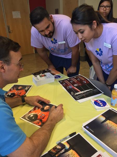 ncall's tweet image. Ret. Space Shuttle Cmdr. Lee Archambault signs autographs and gets big smiles! #SNCDreamChaser, #LVSciFest