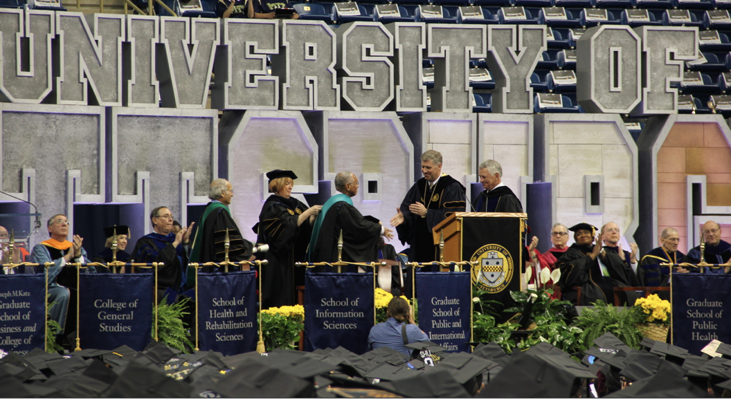 PittTweet's tweet photo. Chancellor Gallagher congratulates Pitt’s #PittCommencement speaker Charles Bolden as he receives his honorary PhD. http://t.co/xYBDVBk63W