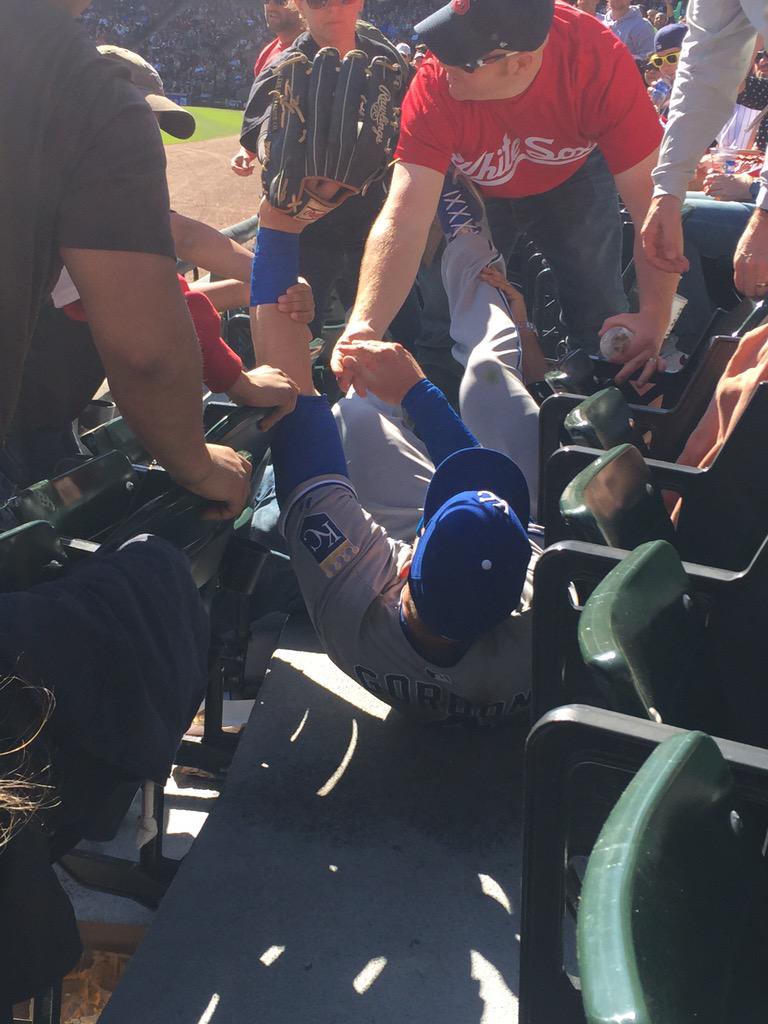 SportsCenter's tweet photo. After Alex Gordon's #SCtop10 catch, one fan snapped this photo of the Gold Glover in the stands. (via @EthanRoutzahn) http://t.co/XsYSGQcdH8