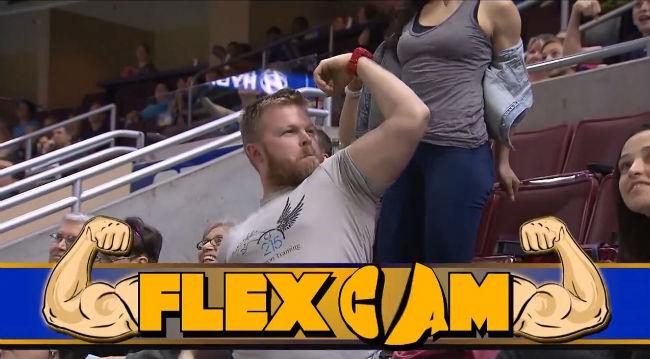 Independent's tweet image. Woman totally upstages male fan on excellently-named flex cam ind.pn/1Kkkh9f