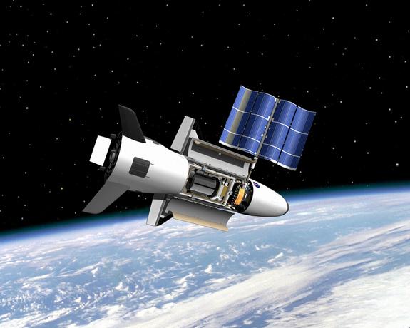 SPACEdotcom's tweet photo. The US Air Force's X-37B space plane will launch on its fourth mystery mission next month. http://t.co/lctSRkPfn2 http://t.co/DGQQrk80Ph
