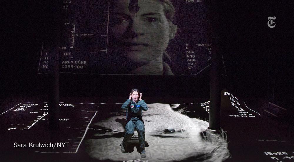 nytimes's tweet photo. Anne Hathaway gives a fiercely good performance as a cocky Air Force pilot in "Grounded" http://t.co/SZ7izHYSoQ http://t.co/86JdyTLG0H