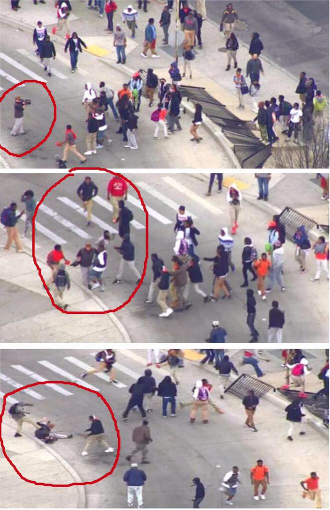 drunkamerica's tweet photo. There's a white person in #Baltimore? Never mind, they got him.  #BaltimoreRiots http://t.co/TtWPpYCrox