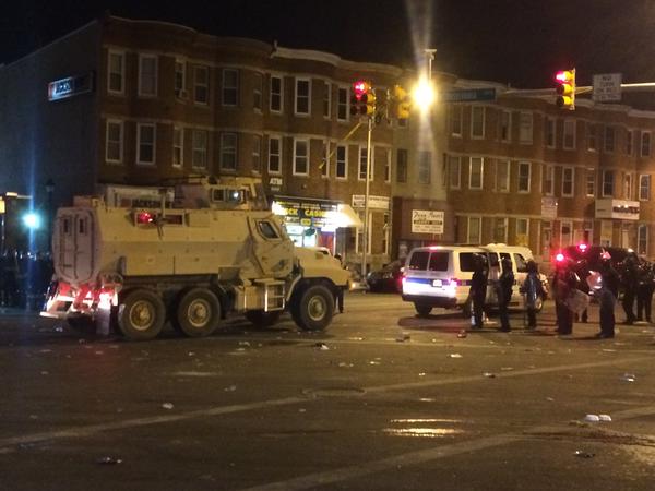 RT_com's tweet photo. #BALTIMORERIOTS: Fires across city, at least 15 cops injured, National Guard trucks at scene http://t.co/UXHrwROTlG http://t.co/jQgDp6stxI