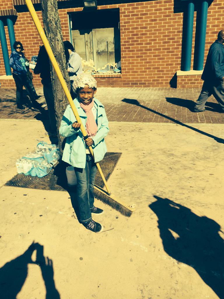 cnni's tweet image. These people are all helping clean the streets of Baltimore after Monday night's riots: cnn.it/1KpIyuG