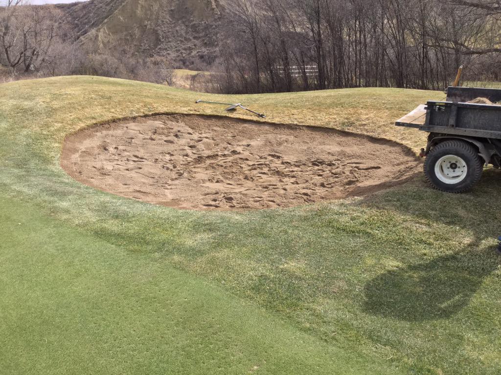 Start hauling in new sand and spreading it out to a depth of 2-4 inches.