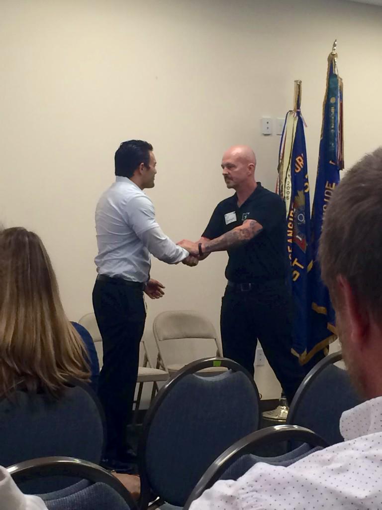 Wendy_Tatum's tweet photo. AFN Inaugural Mtg! Retired Marine Master Sergeant, George Page gives Challenge Coin to Damien Iniguez #tobeapartner http://t.co/9q68pOZaEs