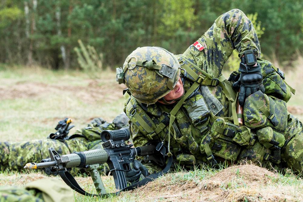 CJOC_COIC's tweet photo. A #3RCR soldier reaches for a thunder-flash during hasty-attack training on #OpREASSURANCE in #Poland http://t.co/20eMzZQ3rb