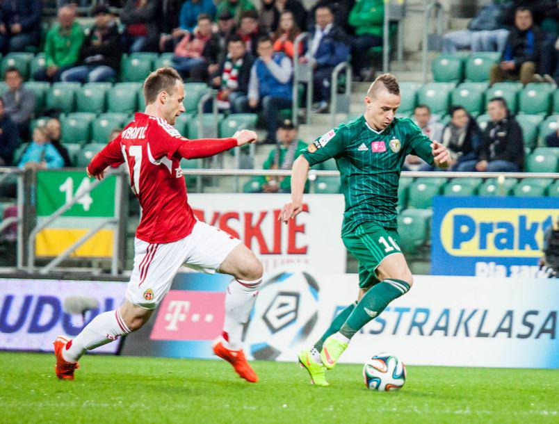 Stjepanovic (L) defends his marker